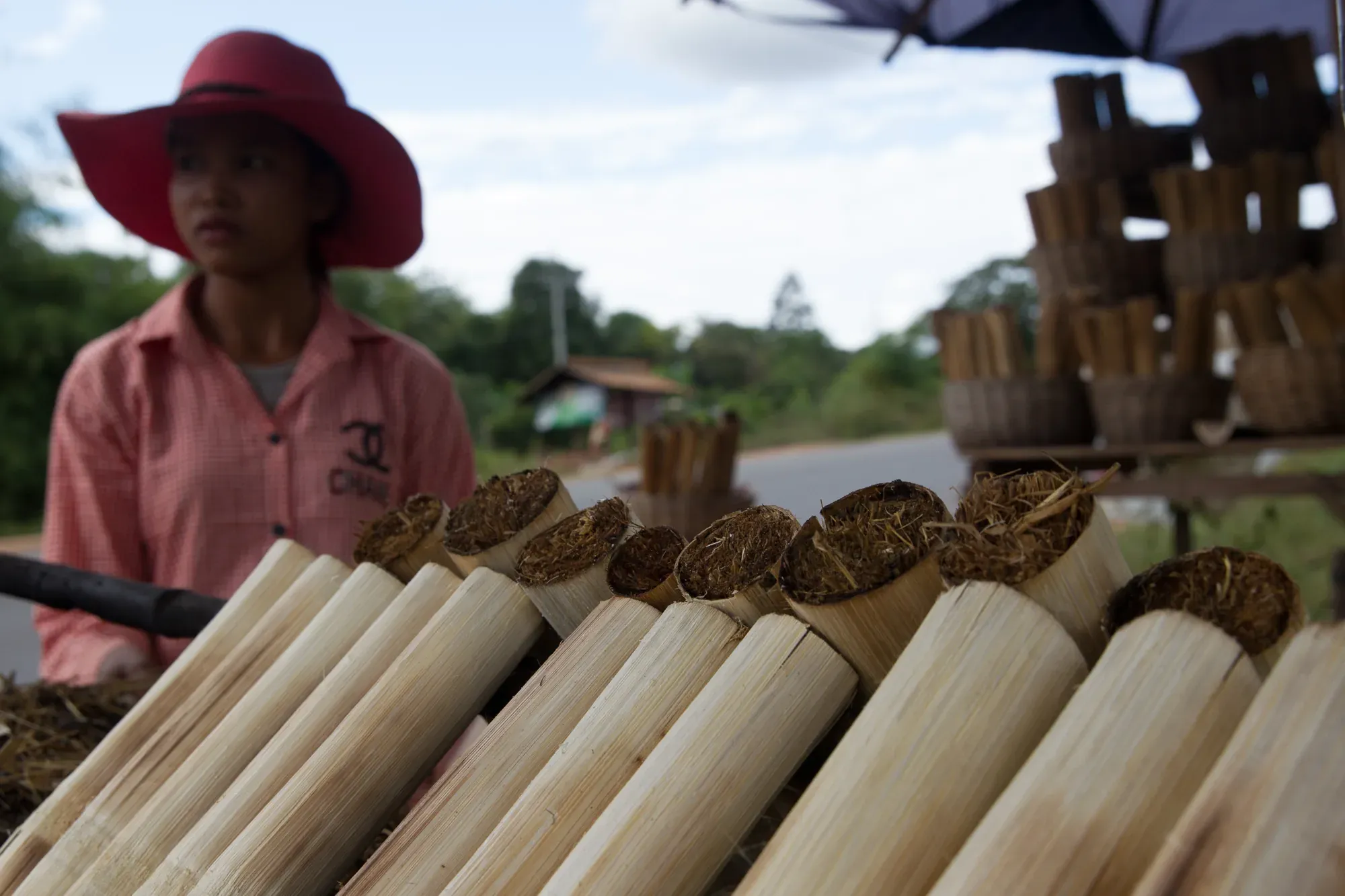 Bamboo sticky rice (kralan) at a roadside stall