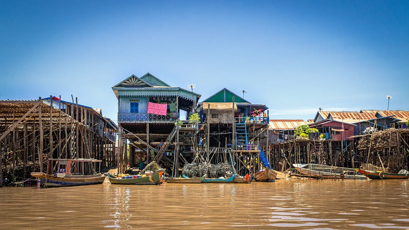 Red-roofed stilt houses at Kompong Phluk at high water