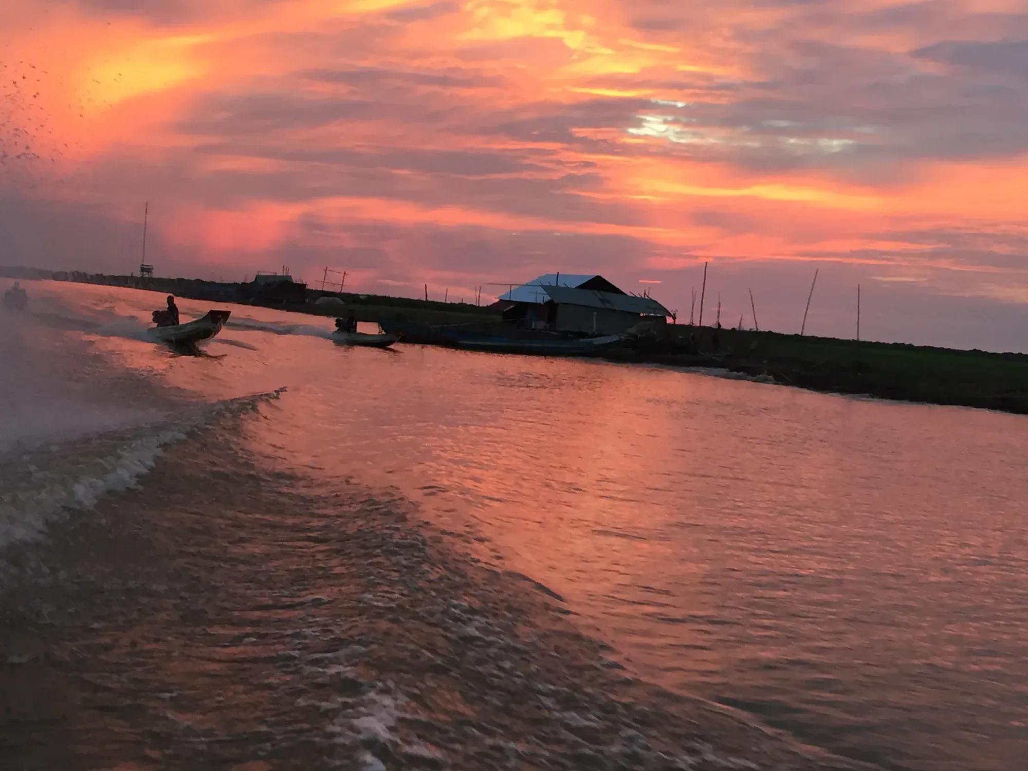 Sunset over Tonle Sap Lake from a boat
