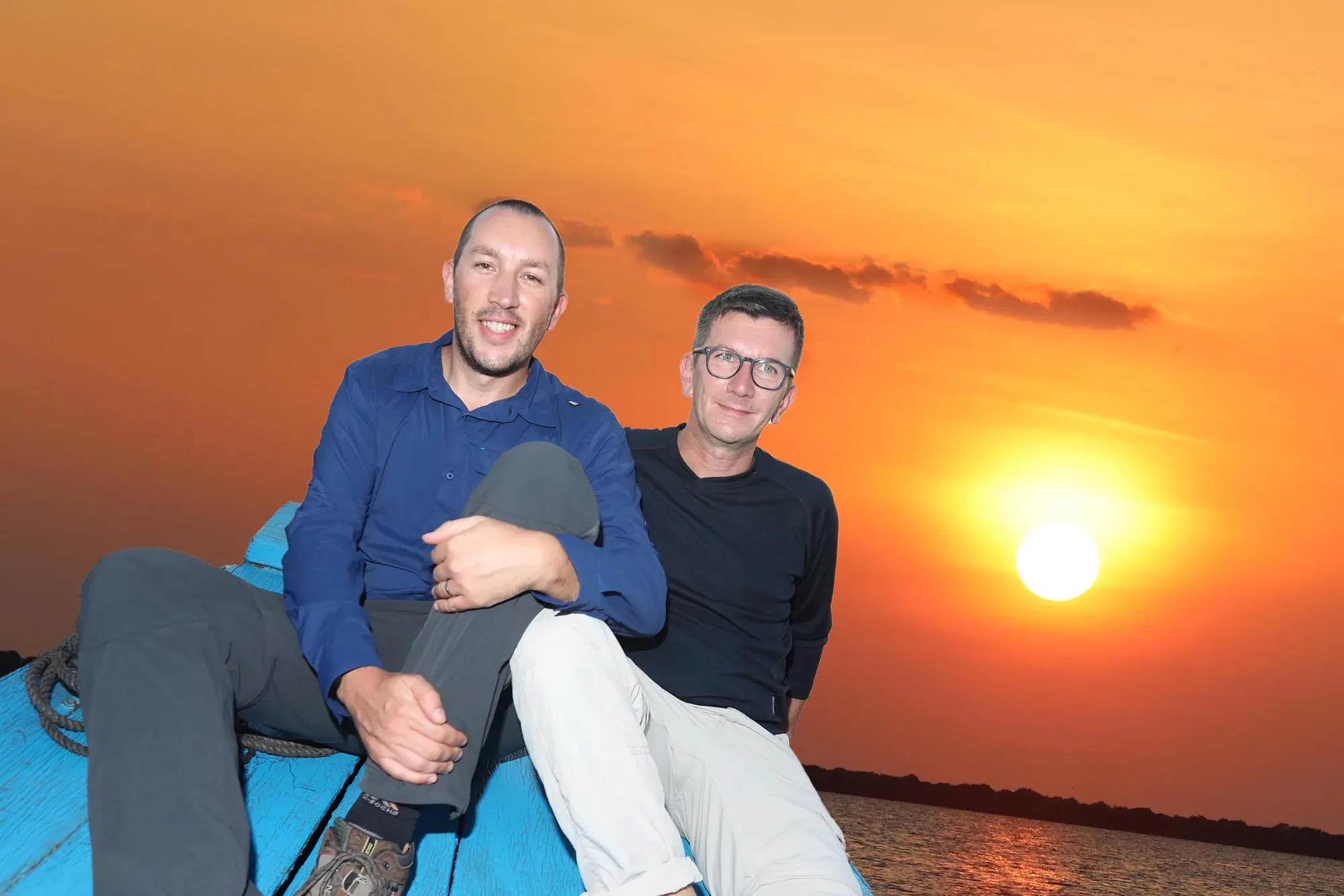 Guests on the boat at sunset on Tonle Sap Lake